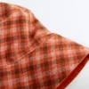 Cappello a secchiello reversibile in misto cotone a quadri Cappello a secchiello reversibile in misto cotone a quadri