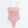 Costume intero a fascia con bordi a contrasto Costume intero a fascia con bordi a contrasto