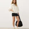 Felpa con mezza zip, tasca frontale, misto lyocell e 24% lino Felpa con mezza zip, tasca frontale, misto lyocell e 24% lino