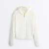 Giacca con cappuccio in maglia traforata