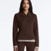 Giacca con peplo effetto neoprene e bordi a costine