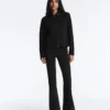 Giacca con peplo effetto neoprene e bordi a costine