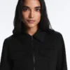 Giacca con peplo effetto neoprene e bordi a costine