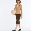 Giacca con peplo effetto neoprene e bordi a costine