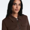 Giacca con peplo effetto neoprene e bordi a costine