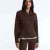 Giacca con peplo effetto neoprene e bordi a costine
