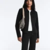 Giacca con peplo effetto neoprene e bordi a costine