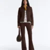 Giacca con peplo effetto neoprene e bordi a costine