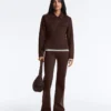 Giacca con peplo effetto neoprene e bordi a costine