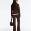 Giacca con peplo effetto neoprene e bordi a costine