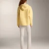 Giacca in finta pelle di montoni con cappuccio Giacca in finta pelle di montoni con cappuccio