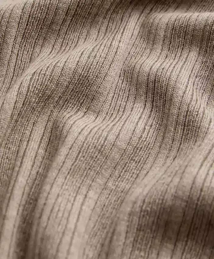 Giacca in maglia a coste con chiusura con lacci laterali Giacca in maglia a coste con chiusura con lacci laterali