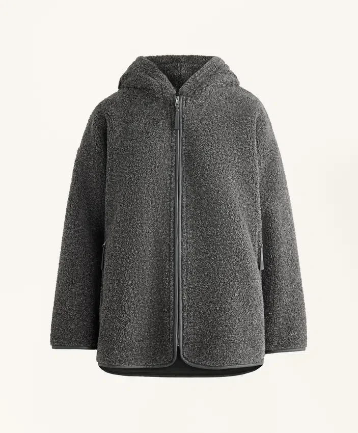 Giacca oversize in finta pelle di montone con cappuccio foderato in pelliccia sintetica Giacca oversize in finta pelle di montone con cappuccio foderato in pelliccia sintetica