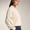 Maglione a collo alto con mini trecce Maglione a collo alto con mini trecce