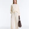 Maglione con scollo a V in maglia a trecce 100% cotone