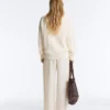 Maglione con scollo a V in maglia a trecce 100% cotone