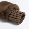 Muffole in pelliccia sintetica con polsino elasticizzato