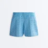 Pantaloncini in maglia a trecce lavata Pantaloncini in maglia a trecce lavata