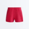 Pantaloncini in maglia a trecce lavata Pantaloncini in maglia a trecce lavata