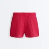 Pantaloncini in maglia a trecce lavata Pantaloncini in maglia a trecce lavata