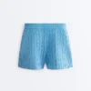 Pantaloncini in maglia a trecce lavata Pantaloncini in maglia a trecce lavata