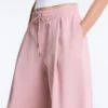 Pantaloni a gamba dritta con pieghe in piqué di cotone Pantaloni a gamba dritta con pieghe in piqué di cotone