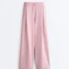 Pantaloni a gamba dritta con pieghe in piqué di cotone Pantaloni a gamba dritta con pieghe in piqué di cotone