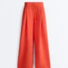 Pantaloni a gamba larga in cotone piqué con pieghe