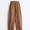 Pantaloni a palloncino a righe in 100% lino Pantaloni a palloncino a righe in 100% lino