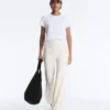 Pantaloni a vita alta a gamba larga con gessato Soft Touch al tatto Pantaloni a vita alta a gamba larga con gessato Soft Touch al tatto