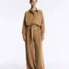 Pantaloni a vita alta in twill a gamba larga con pieghe Pantaloni a vita alta in twill a gamba larga con pieghe