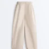 Pantaloni affusolati a pieghe in 100% cotone Pantaloni affusolati a pieghe in 100% cotone