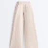 Pantaloni corti a gamba larga con pieghe e righe Pantaloni corti a gamba larga con pieghe e righe