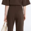 Pantaloni slim a vita bassa in piqué con cotone