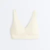 Reggiseno sportivo Comfortlux a sostegno medio con orlo a giorno
