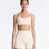 Reggiseno sportivo Evermove a sostegno leggero con stampa floreale