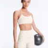 Reggiseno sportivo Evermove a sostegno leggero con stampa floreale