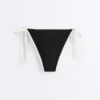 Slip bikini a copertura media con lacci e bordi a contrasto