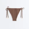 Slip bikini a copertura media con lacci e stampa a mini pois