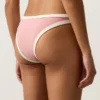 Slip bikini a copertura media con taglio a U e bordi a contrasto