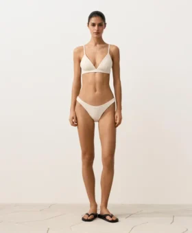 Slip bikini a copertura media con taglio a U e tessuto a bolle