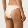 Slip bikini a copertura media con taglio a U e tessuto a bolle