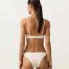 Slip bikini a copertura media con taglio a U e tessuto a bolle