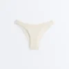 Slip bikini a copertura media con taglio a U e tessuto a bolle