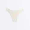 Slip bikini a copertura media con taglio a U e tessuto a bolle