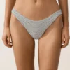 Slip bikini a copertura media con taglio a U in jacquard a pois Slip bikini a copertura media con taglio a U in jacquard a pois
