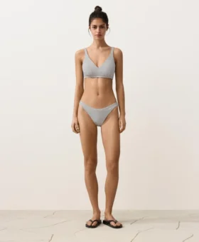 Slip bikini a copertura media con taglio a U in jacquard a pois