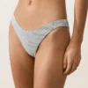 Slip bikini a copertura media con taglio a U in jacquard a pois Slip bikini a copertura media con taglio a U in jacquard a pois