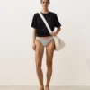 Slip bikini a copertura media con taglio a U in jacquard a pois Slip bikini a copertura media con taglio a U in jacquard a pois
