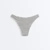 Slip bikini a copertura media con taglio a U in jacquard a pois Slip bikini a copertura media con taglio a U in jacquard a pois